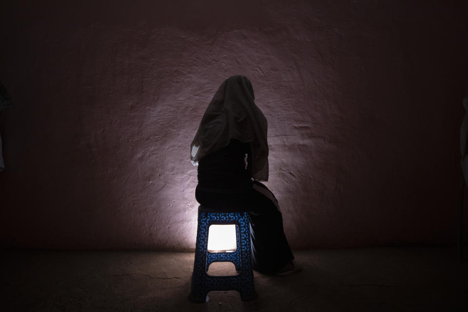 A Tigrayan refugee rape victim who fled the conflict in Ethiopia's Tigray sits for a portrait in eastern Sudan near the Sudan-Ethiopia border, on March 20, 2021. Several refugees from different Tigray communities told the AP they watched or listened helplessly as women were taken away by Amhara or Eritrean fighters and raped. (AP Photo/Nariman El-Mofty)