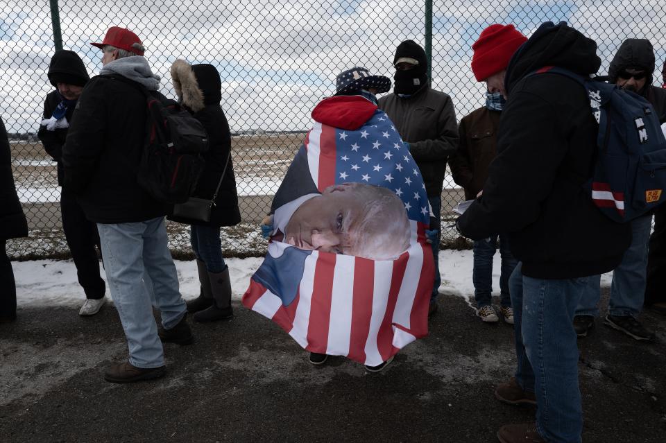 Supporters of Republican presidential candidate former President Donald Trump wait in line to attend a rally with the former president on Feb. 17, 2024 in Waterford, Michigan. People waited in lines for hours outside the event as temperatures held in the mid-20s and a strong wind cut through the crowd.