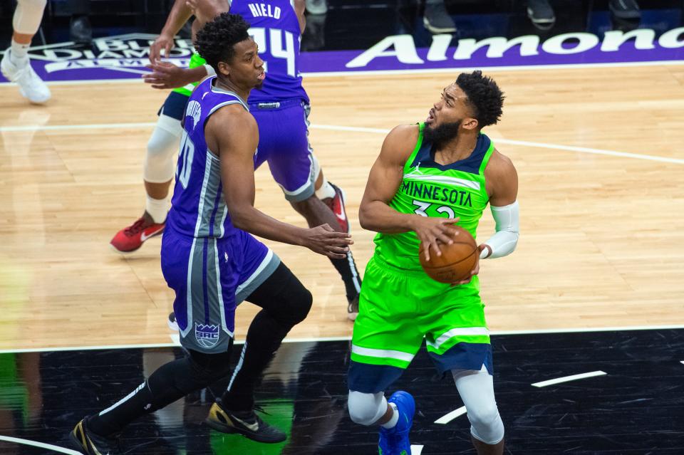 Sacramento Kings center Hassan Whiteside (20) guards Minnesota Timberwolves center Karl-Anthony Towns (32) during the first quarter.