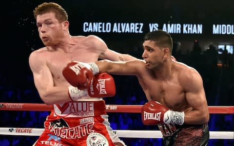 Khan throws a right-handed punch vs Saul Canelo Alvarez - Credit: GETTY IMAGES