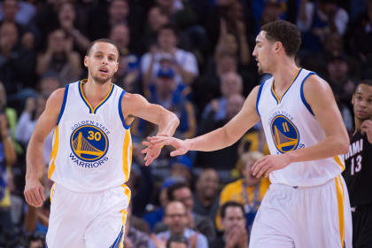 Stephen Curry (30) celebrates with guard Klay Thompson (11) against the Heat. (USA TODAY Sports)