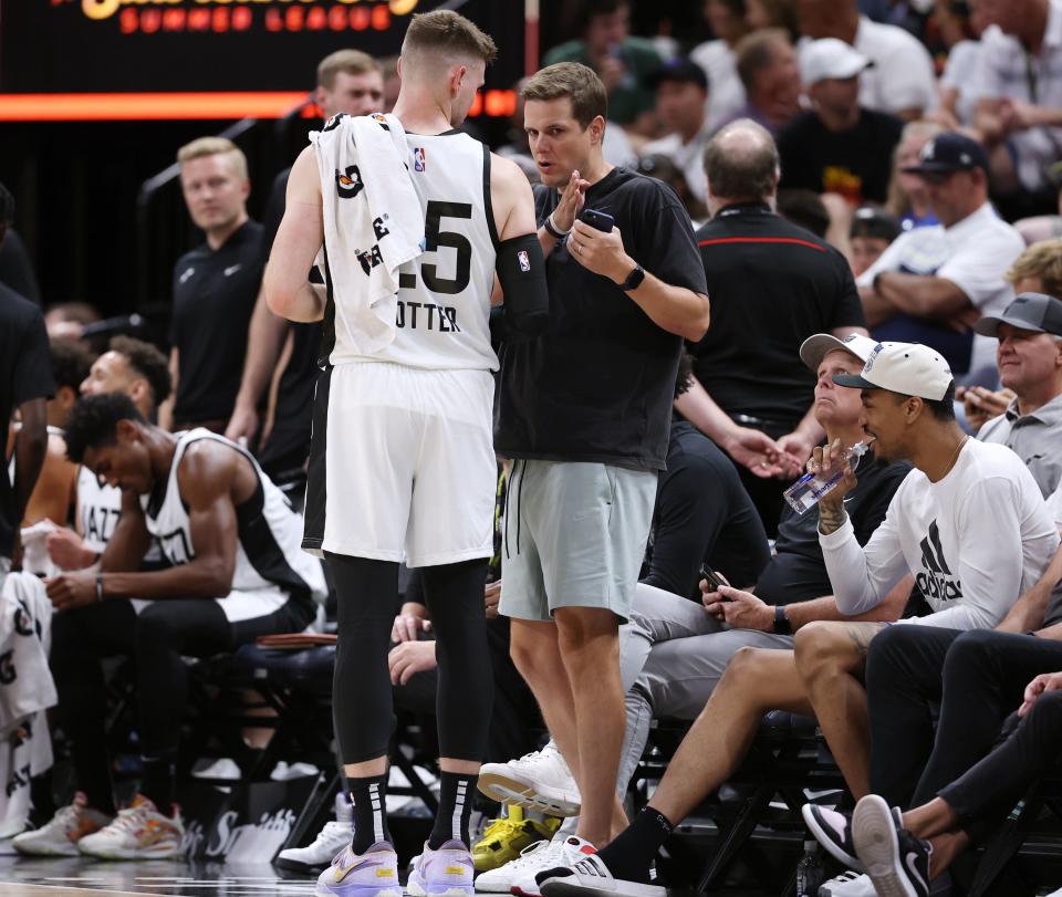 Utah Jazz Head Coach Will Hardy talks with Utah Jazz center Micah Potter (25) during a timeout as the Utah Jazz and Philadelphia 76ers play in Summer League action at the Delta Center in Salt Lake City on Wednesday, July 5, 2023. | Scott G Winterton, Deseret News