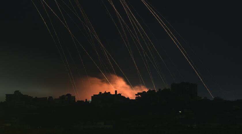 TOPSHOT - This long exposure picture taken from southern Israel near the border with the Gaza Strip shows Israeli shells falling on north Gaza on December 1, 2023. A temporary truce between Israel and Hamas expired on December 1, with the Israeli army saying combat operations had resumed, accusing Hamas of violating the operational pause. (Photo by John MACDOUGALL / AFP) (Photo by JOHN MACDOUGALL/AFP via Getty Images)