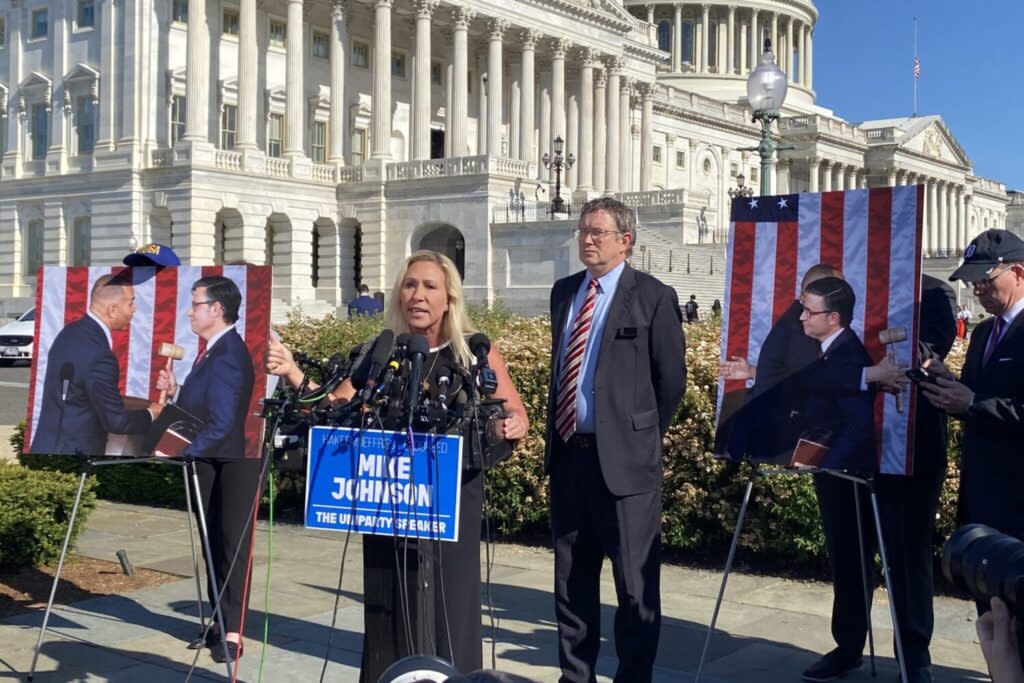 Georgia Republican Rep. Marjorie Taylor Greene speaks during a press conference outside the U.S. Capitol on May 1, 2024, about removing U.S. House Speaker Mike Johnson from the leadership office. Kentucky Republican Rep. Thomas Massie, who supports the effort, stands to her left. (Jennifer Shutt/States Newsroom)