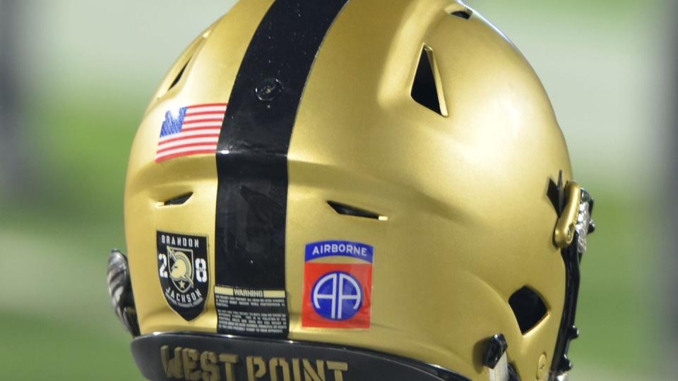 A member of the United States Military Academy football team wears the 82nd Airborne Division patch alongside an emblem honoring fallen Cadet Brandon Jackson during the season opener at Duke University in Durham, North Carolina, Aug. 31, 2018. (Sgt. Brian Stephenson/Army)