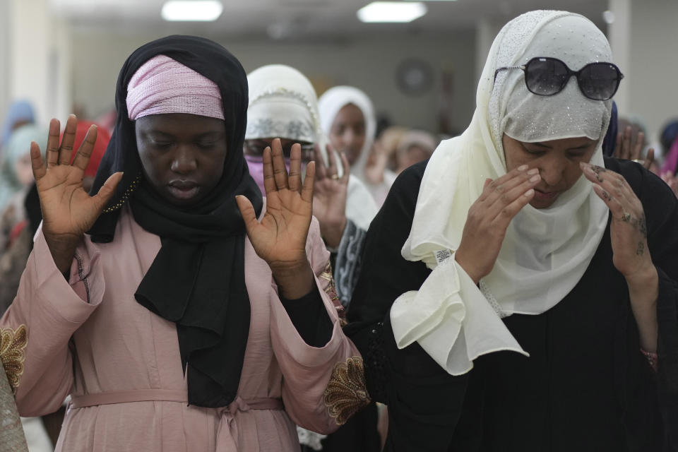 Women gather for prayer during Eid al-Fitr, Friday, April 21, 2023, at the Muslim Community Center in Silver Spring, Md. Eid al-Fitr marks the end of the Muslim holy fasting month of Ramadan. (AP Photo/Carolyn Kaster)