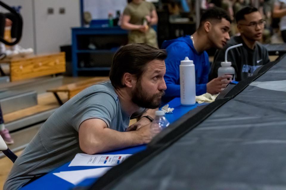 Peoria native Blake Baldi, now head coach of the U.S. Air Force Academy boxing team, watches a bout during the Wing Open event in late February of 2023 in Air Force cadet gym.