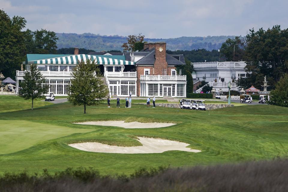 FILE - Golfers gather at Trump National Golf Club in Bedminster, N.J., on Oct. 2, 2020. A group of Sept. 11 victims' family members are condemning former President Donald Trump for hosting the Saudi-backed LIV golf tour at his New Jersey course later this month. (AP Photo/Seth Wenig, File)