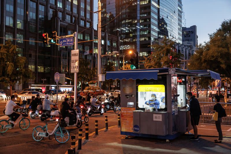 People line up to get a swab at a nucleic acid testing station, set up city-wide to trace possible coronavirus disease (COVID-19) outbreaks in Beijing