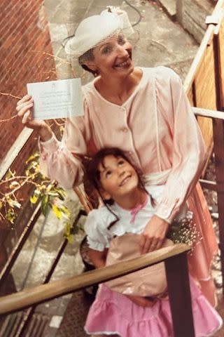 <p>courtesy Anne Allan</p> A photo of Anne Allan and her daughter Emily on the steps of their Highgate flat as Anne is leaving for the Garden Party at Buckingham Palace, Tuesday July 10th, 1984. She is holding the invitation in her hand.