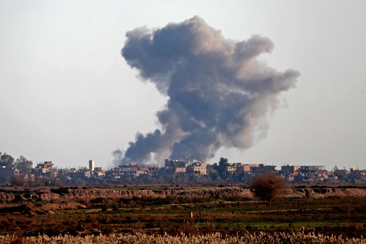 Smoke billows after bombings in the province of Deir Ezzor, near Hajin, eastern Syria, on Dec. 15. Kurdish-led forces seized the Islamic State’s main hub of Hajin on Dec. 14. (Photo: Delil Souleiman AFP/Getty Images)