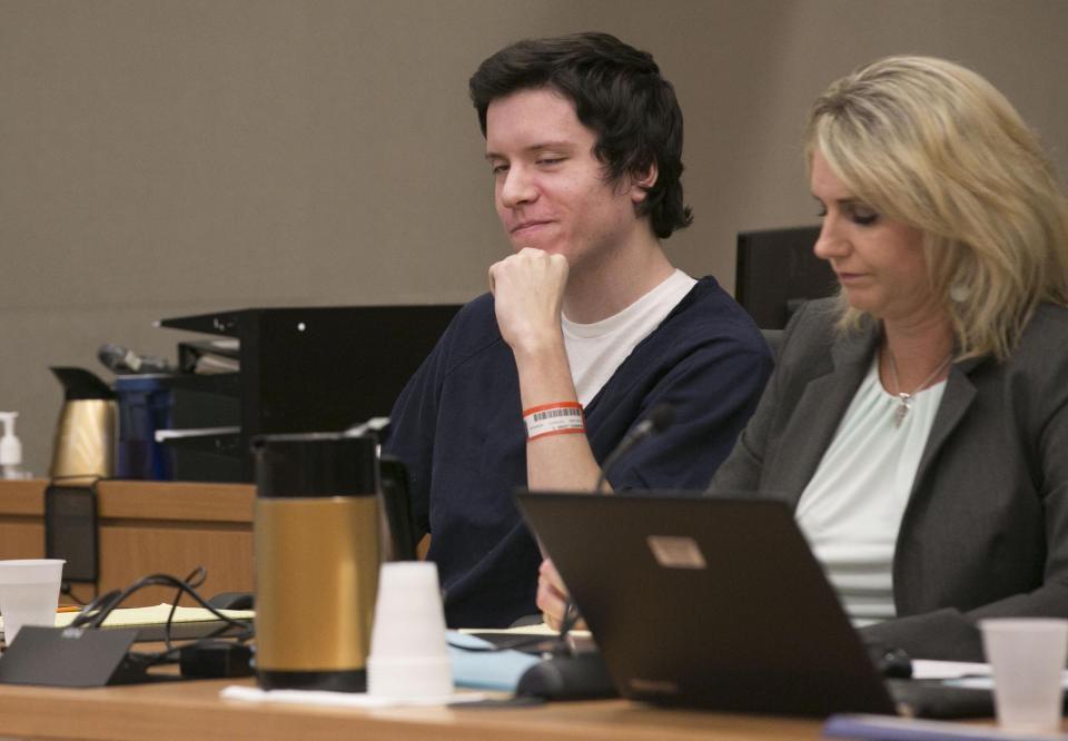 Defendant John Earnest grins during testimony by witness Oscar Stewart during Earnest's preliminary hearing, Thursday, Sept. 19, 2019, in Superior Court in San Diego. Prosecutors say Earnest opened fire during a Passover service at the Chabad of Poway synagogue on April 27, killing one woman and injuring three people, including the rabbi. (John Gibbins/The San Diego Union-Tribune via AP, Pool)
