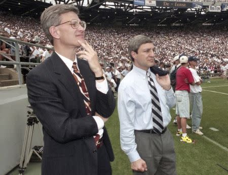 Penn State athletic director Tim Curley (L) and Penn State president Graham Spanier watch the Nittany Lions' football game against Texas Tech from the sidelines of Beaver Stadium in State College, Pennsylvania in this September 9, 1995 file photo. REUTERS/Craig Houtz/Files