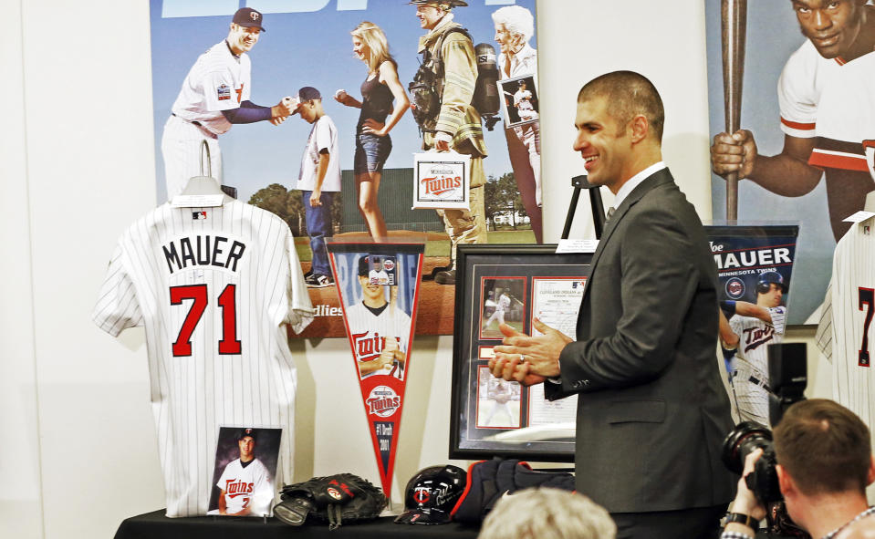 Joe Mauer arrives for his retirement news conference Monday, Nov. 12, 2018, in Minneapolis, after playing 15 major league seasons, all with the Minnesota Twins baseball team. (AP Photo/Jim Mone)