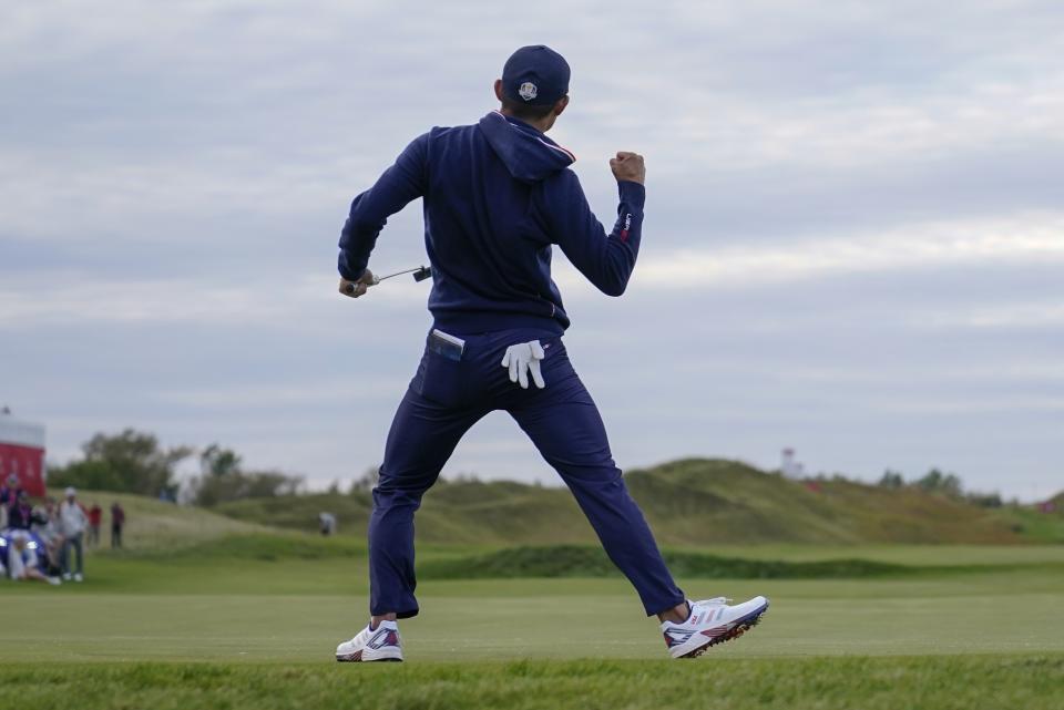 Team USA's Collin Morikawa makes a putt on the 15th hole during a four-ball match the Ryder Cup at the Whistling Straits Golf Course Saturday, Sept. 25, 2021, in Sheboygan, Wis. (AP Photo/Ashley Landis)