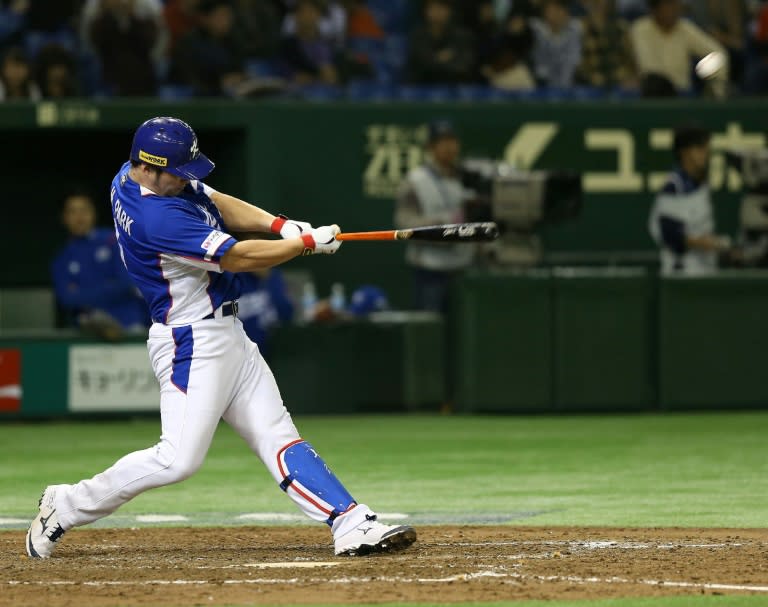 South Korean slugger Park Byeong-Ho hits a three-run homer during the final of the Premier 12 baseball tournament in Tokyo on November 21, 2015