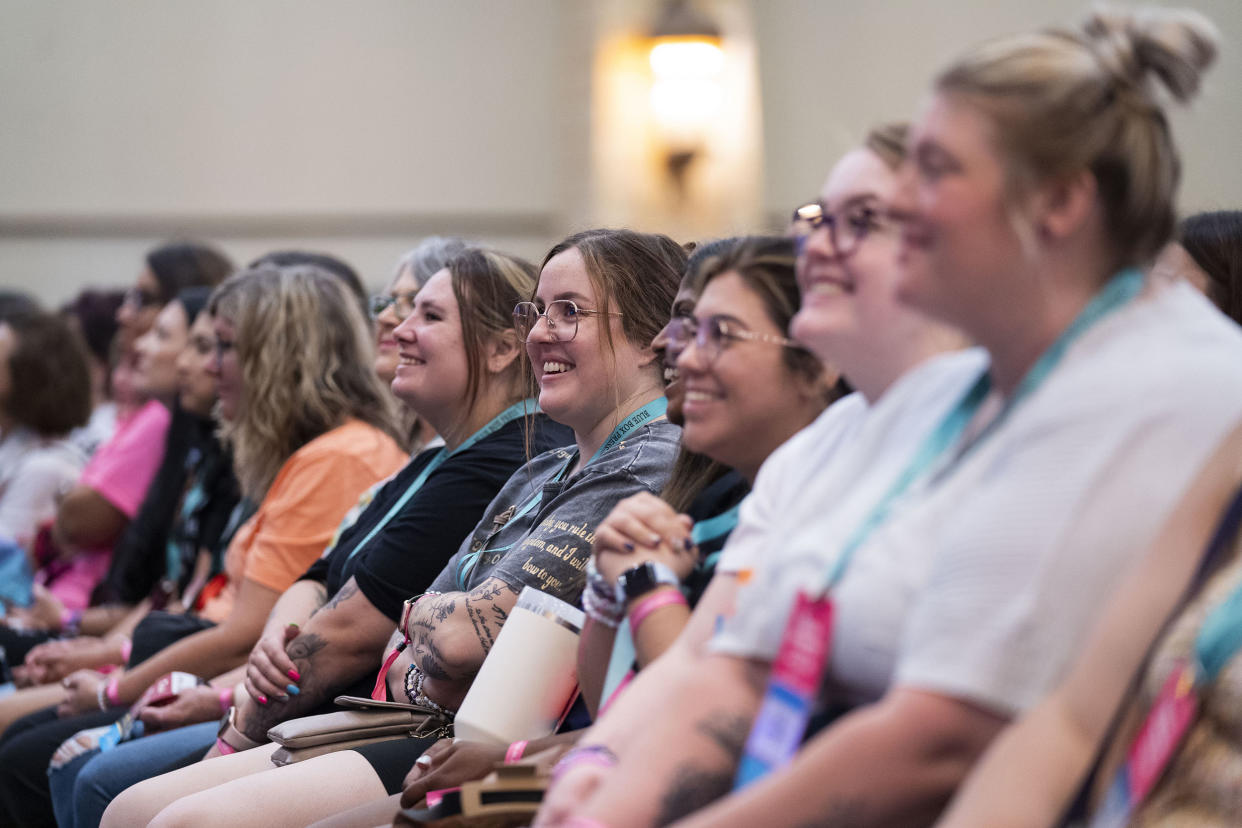 As Colleen Hoover speaks on stage, fans engage at Book Bonanza  on June 23, 2023 in Grapevine, TX.  (Nitashia Johnson for TODAY)