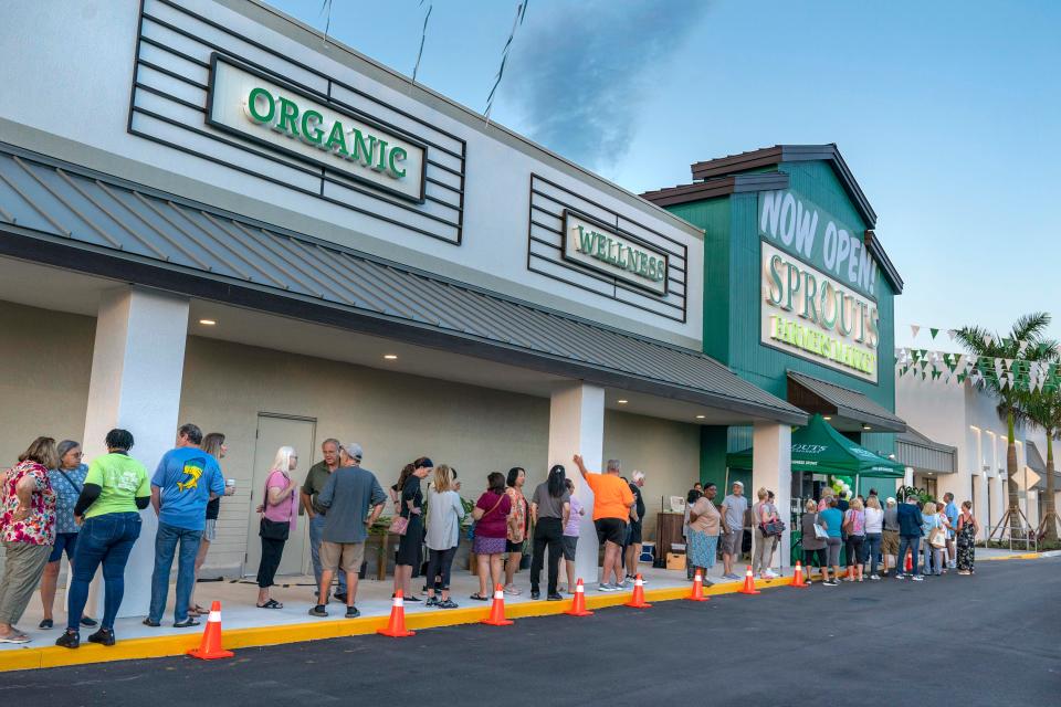 Customers line up for the early morning opening of the new Sprouts Farmers Market on June 9, 2023 in Delray Beach, Florida.