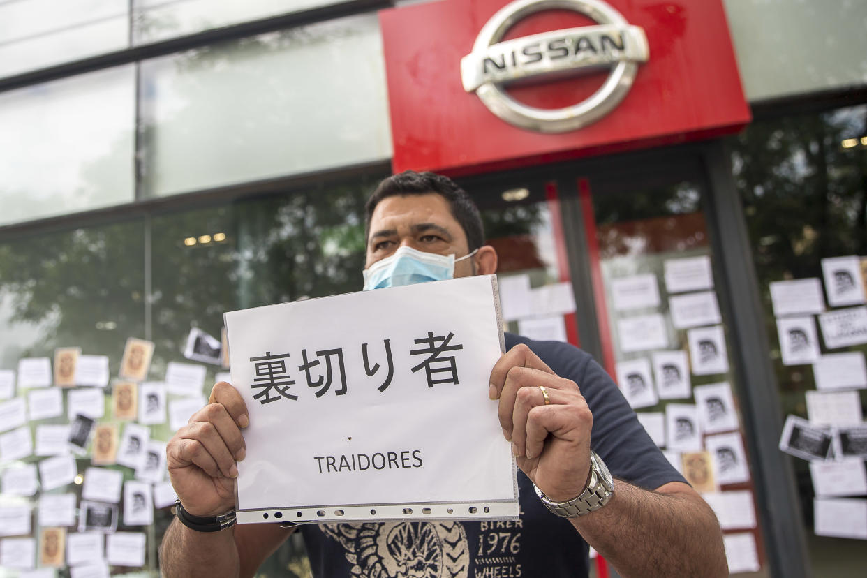 Workers and relatives of the car company NISSAN gather in front of several multinational vehicle shops to protest against the closure of the three plants in Barcelona that could send more than 23,000 people unemployed between direct and indirect work during the Coronavirus - Covid-19 crisis in Barcelona, Catalonia, Spain, on May 29, 2020.  (Photo by Albert Llop/NurPhoto via Getty Images)