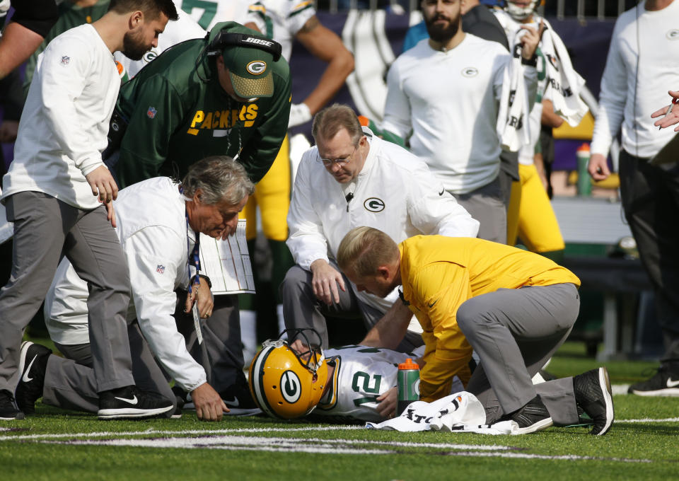 Green Bay Packers quarterback Aaron Rodgers broke his collarbone on a hit by Vikings linebacker Anthony Barr. (AP)