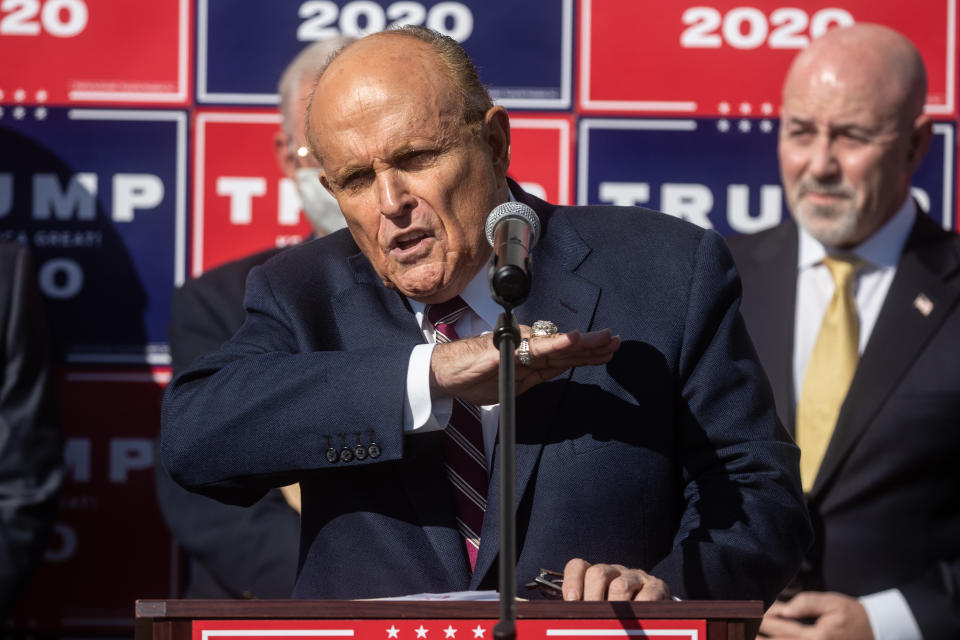 PHILADELPHIA, PENNSYLVANIA - NOVEMBER 07: Attorney for the President, Rudy Giuliani speaks to the media at a press conference held in the back parking lot of Four Seasons Total Landscaping on November 7, 2020 in Philadelphia, Pennsylvania. The press conference took place just minutes after news networks announced that Joe Biden had won the presidency over Donald Trump after it was projected that he had won the state of Pennsylvania. (Photo by Chris McGrath/Getty Images)