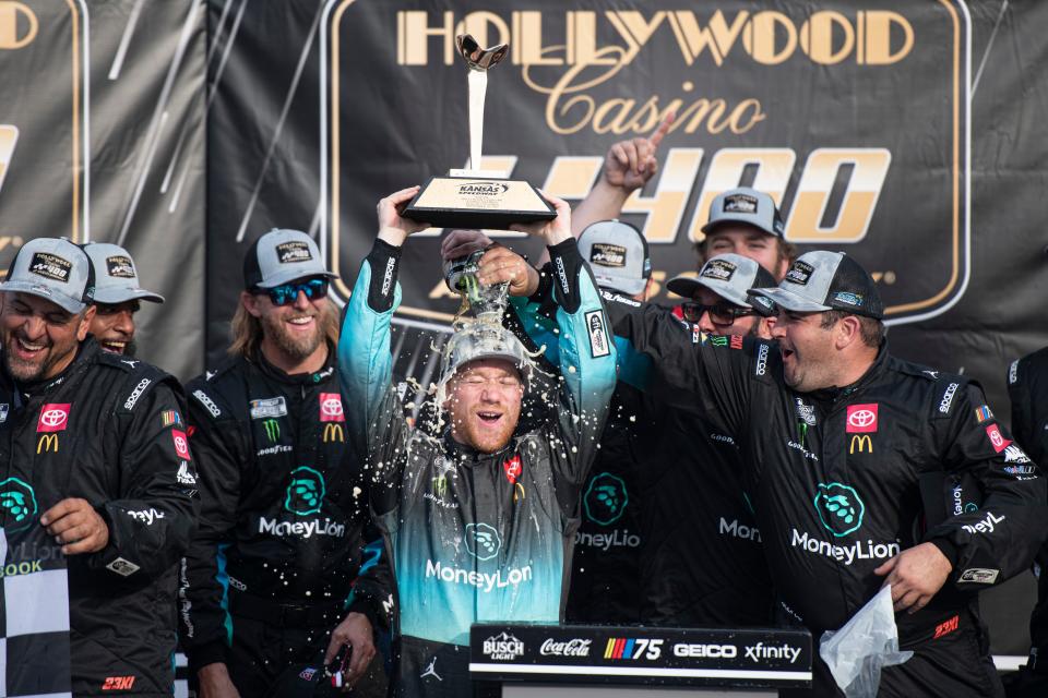Tyler Reddick (45) celebrates winning the NASCAR Cup Series Hollywood Casino 400 at Kansas Speedway in 2023.