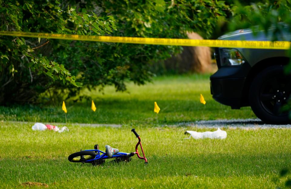 A child’s bike, along with evidence markers, in the front yard of the home in Monroe Township where three brothers, ages, 3, 4 and 7, were killed, execution style according to Dave Gast, Clermont County's chief prosecutor. He said Doerman has admitted to using a rifle to kill his sons.