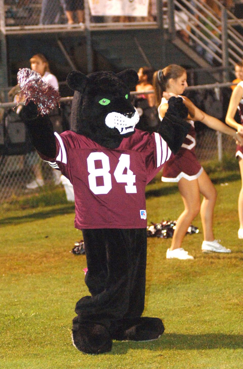 Lakeside High School's panther mascot joins in with the cheerleader during a football in this photo from 2006. The panther is one of Georgia's most popular high school mascots.