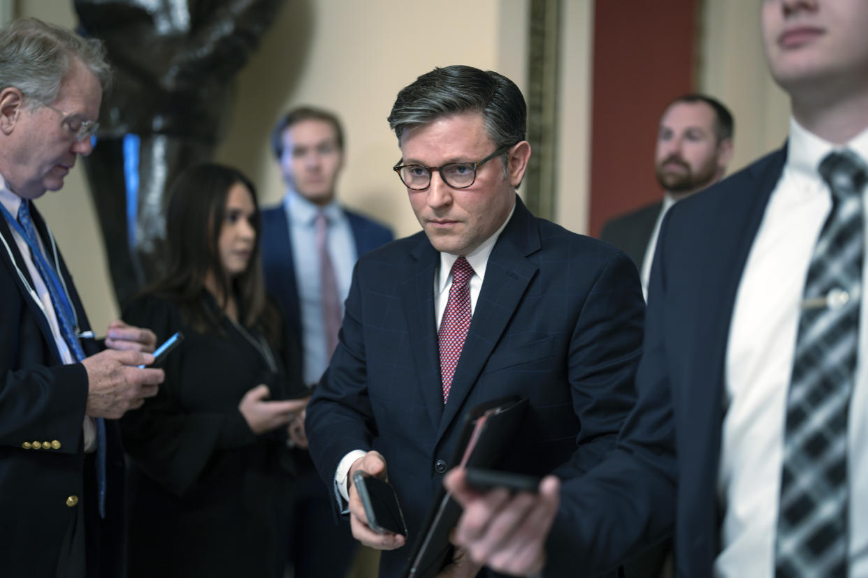 Speaker of the House Mike Johnson, R-La., heads to the chamber at the Capitol in Washington, Friday, Jan. 12, 2024. (AP Photo/J. Scott Applewhite)