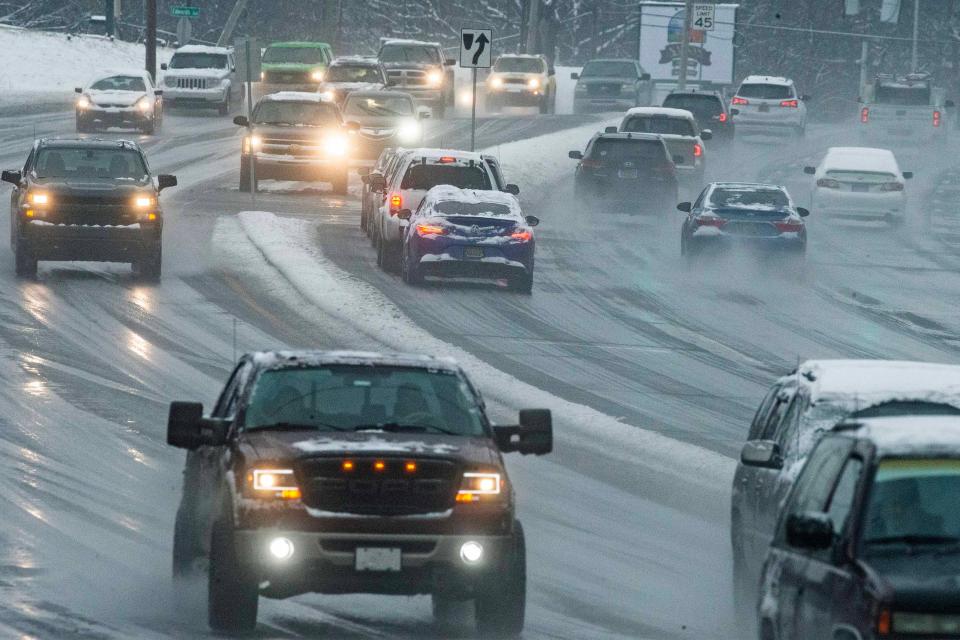 Drivers maneuver a messy commute along Kirkwood Highway after a snowstorm dropped close to 3 inches since yesterday in Wilmington, Tuesday, Jan. 16, 2023.