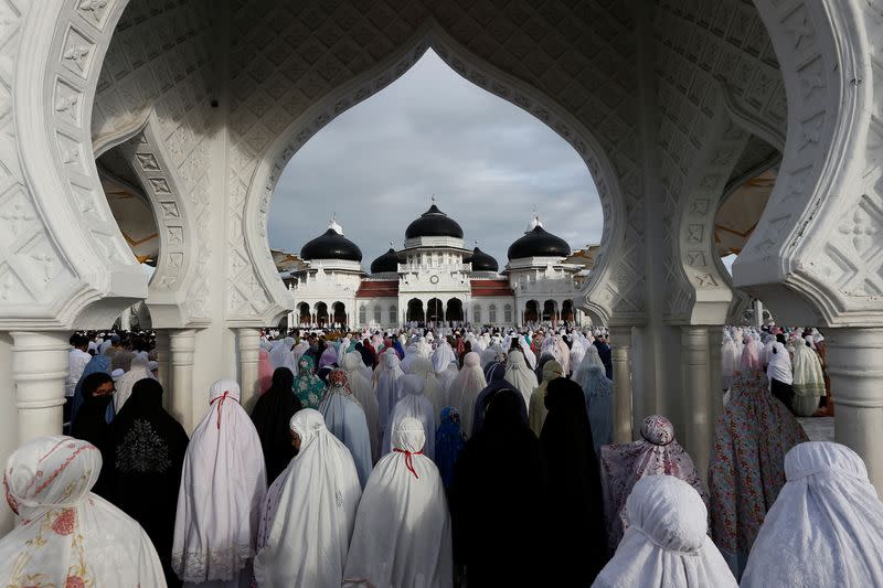 Indonesian Muslim women pray during Eid al-Fitr, the Muslim festival marking the end the holy fasting month of Ramadan, at a mosque in Bandah Aceh