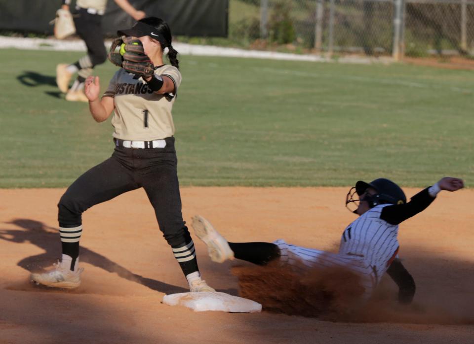 Sarasota's Jayden Baker is forced out at second by MItchell's Madison Antioco during the Class 6A regional semifinal Thursday night at the Sailors field.