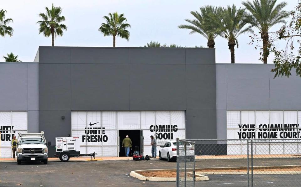 Workers seen at the still under construction Nike retail store at River Park, at the old Macaroni Grill site, photographed Wednesday, Jan. 10, 2024 in Fresno.