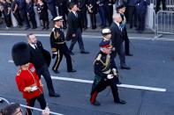 <p>Britain's King Charles III (4R), Britain's Princess Anne, Princess Royal (3R), Britain's Prince Andrew, Duke of York (2R) and Britain's Prince Edward, Earl of Wessex (R) walk behind the procession of Queen Elizabeth II's coffin, from the Palace of Holyroodhouse to St Giles Cathedral, on the Royal Mile on September 12, 2022, where Queen Elizabeth II will lie at rest. - Mourners will on Monday get the first opportunity to pay respects before the coffin of Queen Elizabeth II, as it lies in an Edinburgh cathedral where King Charles III will preside over a vigil. (Photo by ODD ANDERSEN/POOL/AFP via Getty Images)</p> 