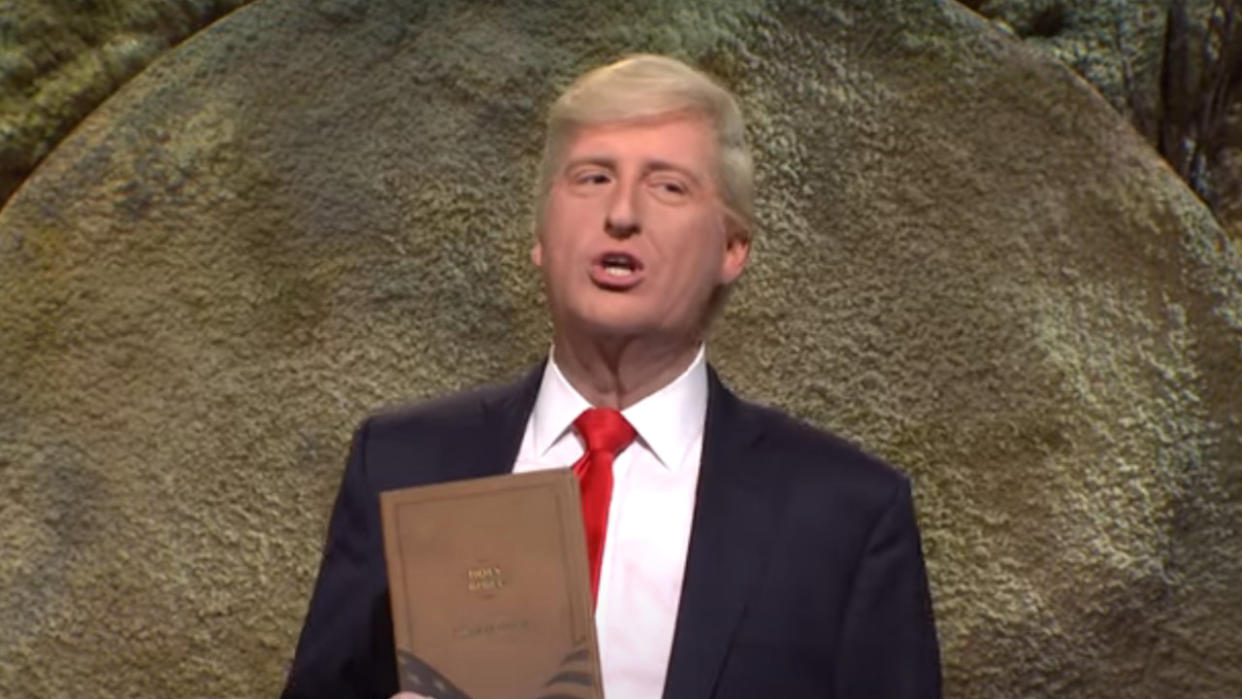  James Austin Johnson as Donald Trump selling Bibles in a suit on SNL. 