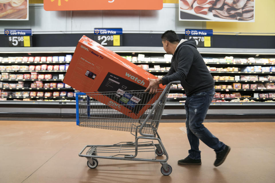 KING OF PRUSSIA, PA - NOVEMBER 28: A man shops for a television in Walmart on Thanksgiving night ahead of Black Friday on November 28, 2019 in King of Prussia, United States. (Photo by Sarah Silbiger/Getty Images)