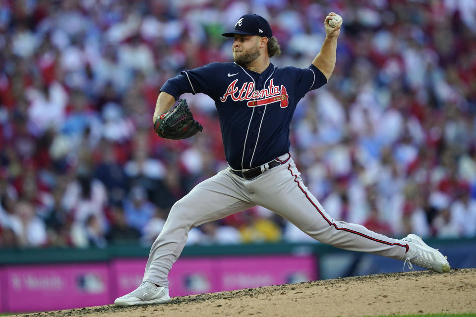 Atlanta Braves relief pitcher A.J. Minter (33) works during the fifth inning in Game 4 of baseball's National League Division Series between the Philadelphia Phillies and the Atlanta Braves, Saturday, Oct. 15, 2022, in Philadelphia. (AP Photo/Matt Rourke)