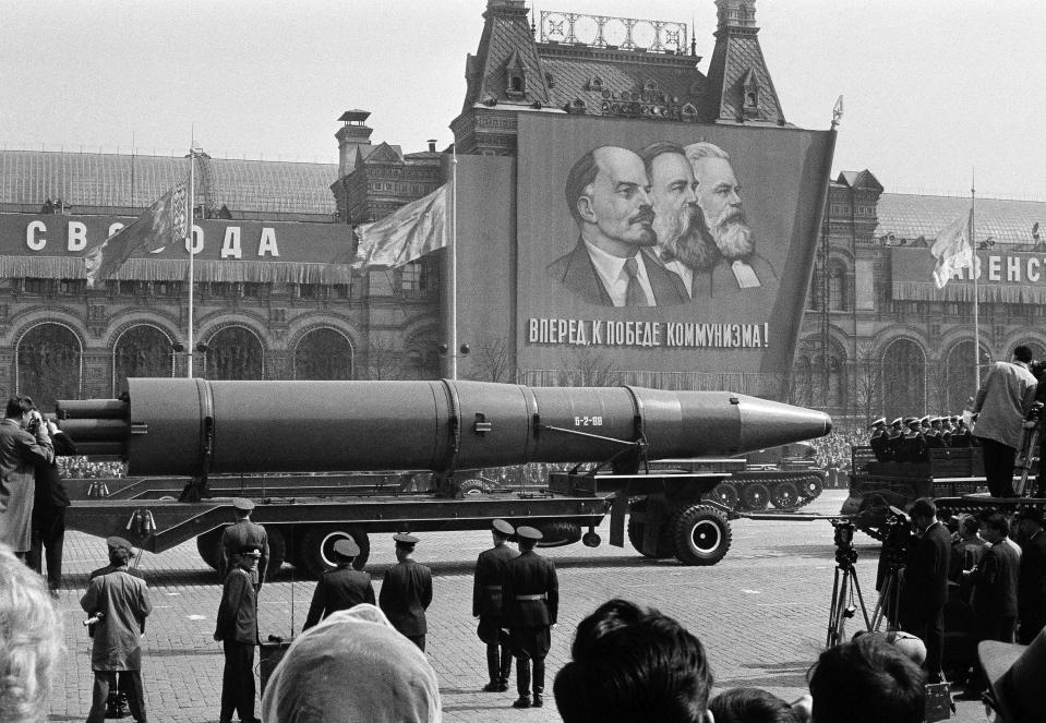 FILE - A naval rocket is exhibited in Moscow's Red Square past a banner of Vladimir Lenin, Friedrich Engels and Karl Marx during the annual May Day parade in the Soviet Union in May 1, 1963. Under the shadow of the Cold War's threat of "mutually assured destruction," 1963 was the year of dawning arms control between the U.S. and the Soviet Union; they signed a Nuclear Test Ban Treaty. (AP Photo/File)