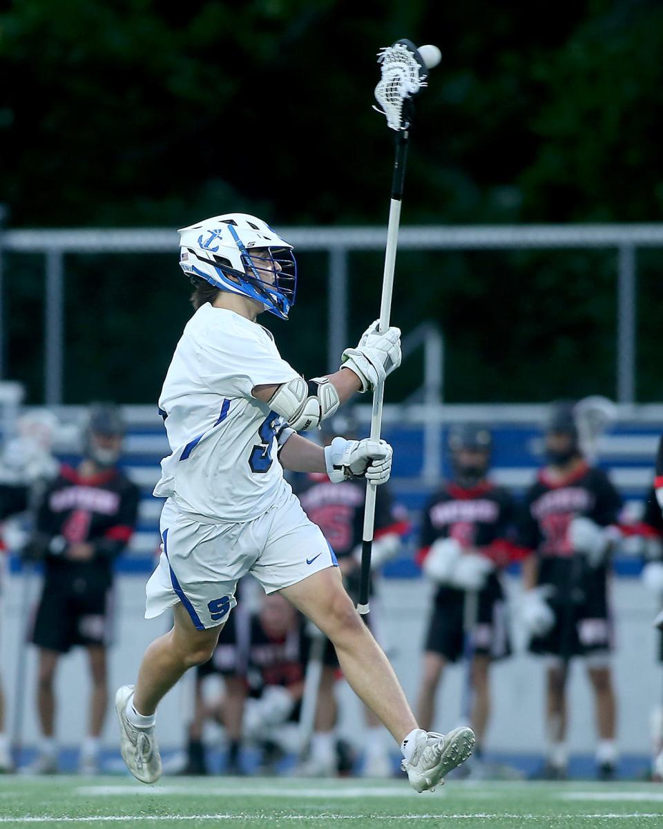 Scituate's Alex Burrill gets the assist on a goal by Scituate's Joe Cahill that gave Scituate the 13-2 lead over Whitman-Hanson during second quarter action of their game against Whitman-Hanson in the Round of 32 of the Division 2 state tournament at Scituate High School on Tuesday, June 7, 2022. 