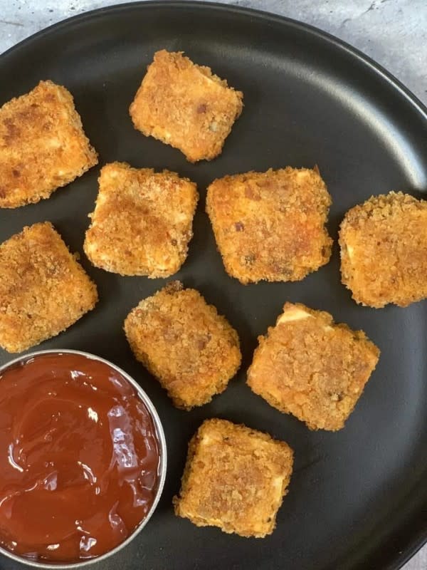 <p>Indian Veggie Delight</p><p>Paneer Popcorn, also known as paneer nuggets is a quick, easy, healthy air fryer snack recipe made with fresh paneer (Indian cottage cheese), mixed with spices and herbs, and tossed with breadcrumbs to give that extra punch to taste. </p><p><strong>Get the recipe here: <a href="https://www.indianveggiedelight.com/paneer-popcorn-recipe-air-fryer/" rel="nofollow noopener" target="_blank" data-ylk="slk:Paneer Popcorn;elm:context_link;itc:0;sec:content-canvas" class="link ">Paneer Popcorn</a></strong></p>