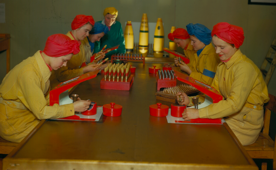 Women working on dummy explosives in a factory during World War II.