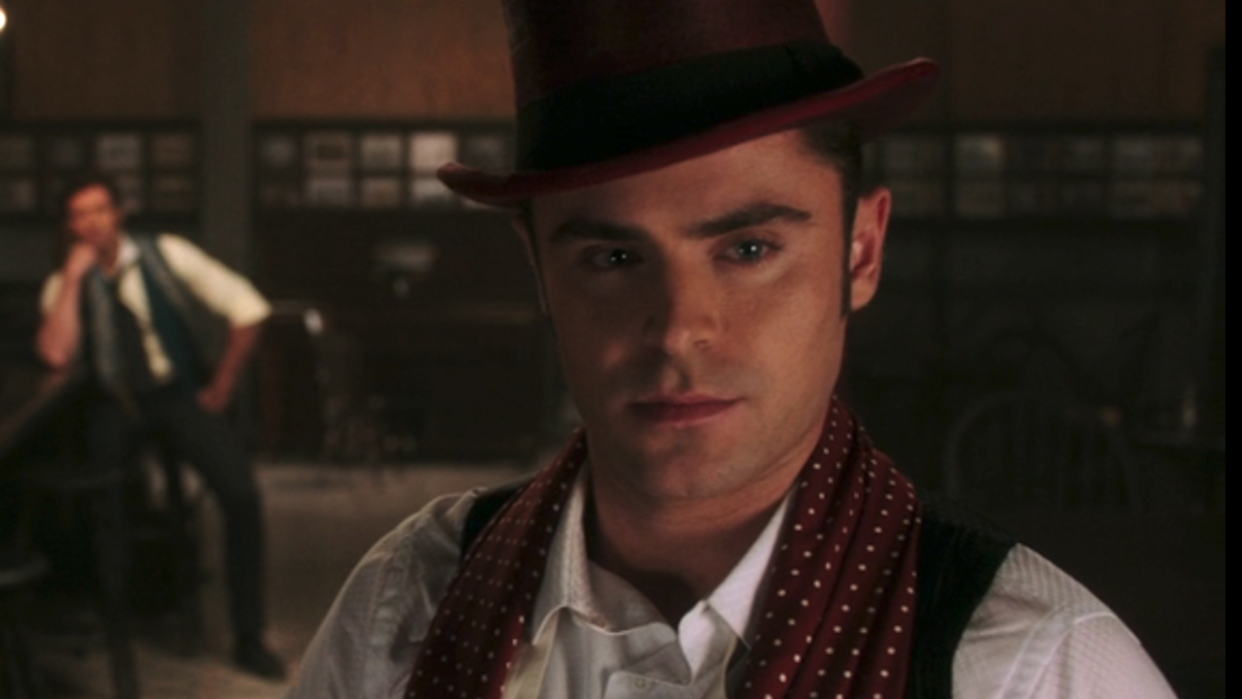  Zac Efron in maroon top hat in The Greatest Showman. 