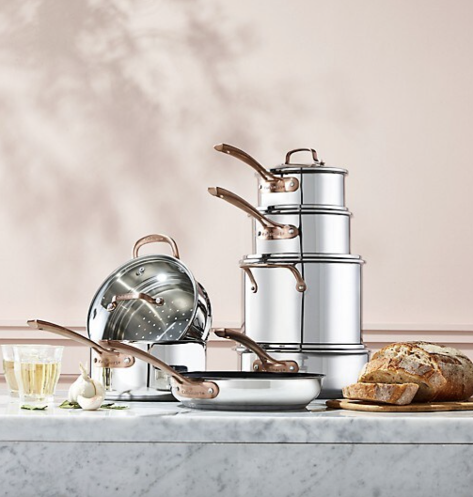 Cuisinart Metal Expressions 12-Piece Stainless Steel Cookware Set on countertop with bread and pink wall (Photo via The Bay)