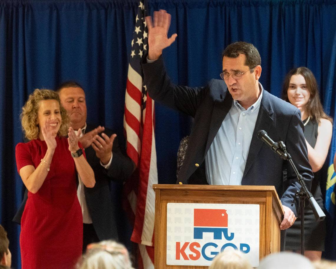 Kansas Republican nominee for governor Derek Schmidt, right, and his running mate for Lt. Governor, Katie Sawyer, left, appear at a watch party Tuesday, August 2, 2022, in Overland Park. Schmidt won his primary and will square off against Democratic Gov. Laura Kelly in the general election.