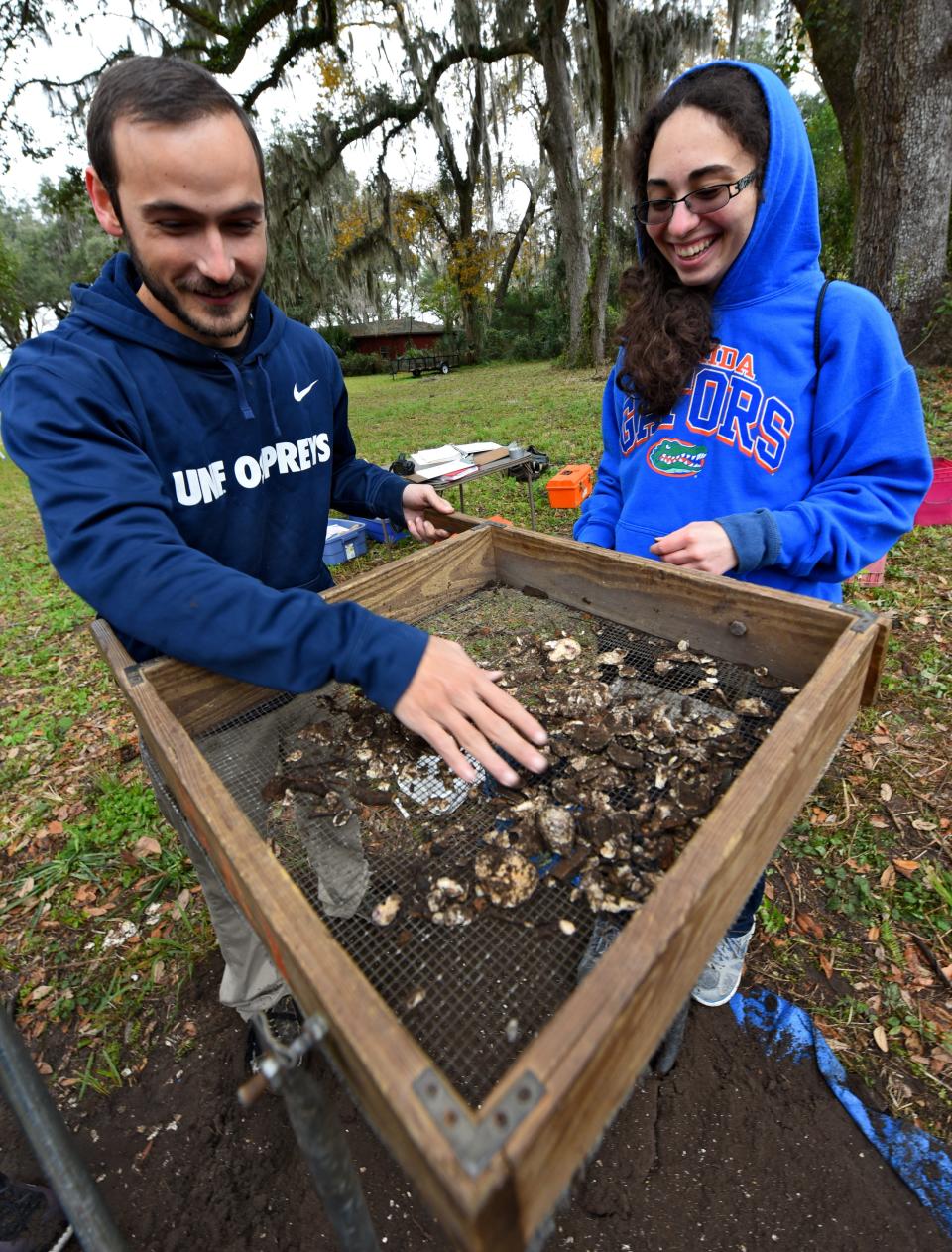 At a University of North Florida archaeological dig in 2018, Warner Flower, a UNF graduate, and Emmalynn Myles, a junior history major, sort through objects found at the what's called the Mill Cove Complex in Arlington, which 1,000 years ago was a major Native American site.