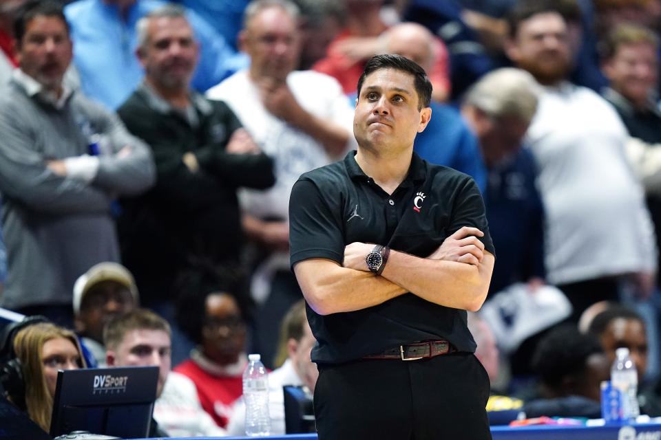 Cincinnati Bearcats head coach Wes Miller looks up at the score in the second half of the 91st Crosstown Shootout basketball game between the Cincinnati Bearcats and the Xavier Musketeers, Saturday, Dec. 9, 2023, at Cintas Center in Cincinnati. The Xavier Musketeers won, 84-79.