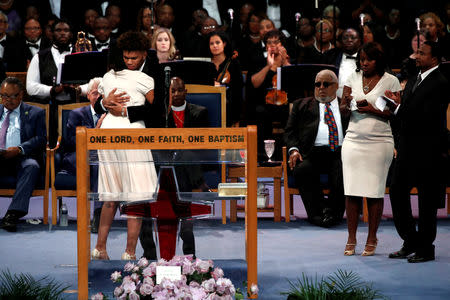 Jordan Franklin, grandson of Aretha Franklin, is comforted by Victorie Franklin as he speaks at the funeral service for Aretha Franklin t the Greater Grace Temple in Detroit, Michigan, U.S., August 31, 2018. REUTERS/Mike Segar