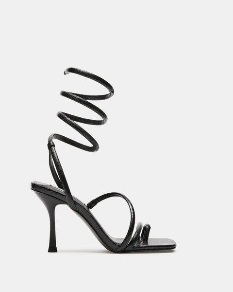 <p><a href="https://go.redirectingat.com?id=74968X1596630&url=https%3A%2F%2Fwww.stevemadden.com%2Fproducts%2Fshantelle-black&sref=https%3A%2F%2Fwww.biography.com%2Fbio-buys%2Fa60721389%2Fhow-to-recreate-met-gala-after-party-looks-2024%2F" rel="nofollow noopener" target="_blank" data-ylk="slk:Shop Now;elm:context_link;itc:0;sec:content-canvas" class="link ">Shop Now</a></p><p>Shanetelle Heels</p><p>stevemadden.com</p><p>$69.97</p>