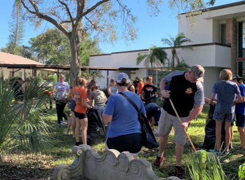 Athletes from Sarasota High School help with the cleanup on Monday at Concordia Lutheran Church. The athletes volunteered to go around to neighborhood churches and at school to help remove debris after the devastating effects from Hurricane Ian.