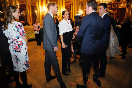 Britain's Prince Harry and Meghan, Duchess of Sussex, meet guests during a pre-ceremony reception before the Endeavour Fund Awards in the Drapers' Hall in London, Britain February 7, 2019. Tolga Akmen/Pool via REUTERS